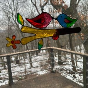 Bird sun catcher. Birds kissing.